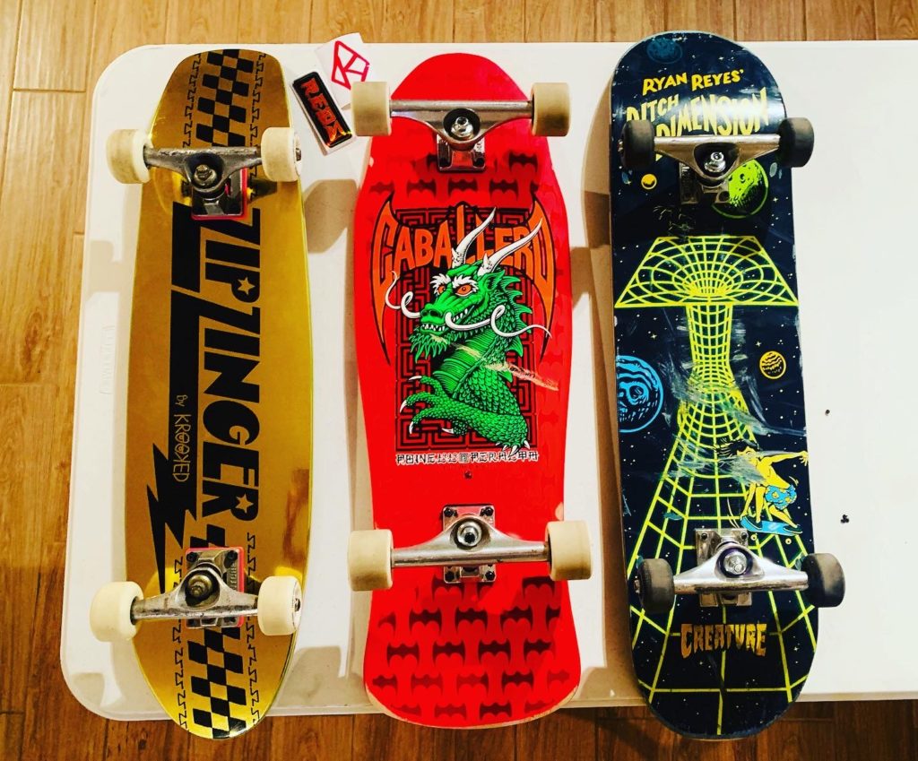 From left to right: Zip Zinger deck with skinny Ventures and soft wheels, Powell Peralta Bat Dragon reissue deck with Indys and PP soft slide wheels, Creature deck with Ventures and tiny hard wheels 