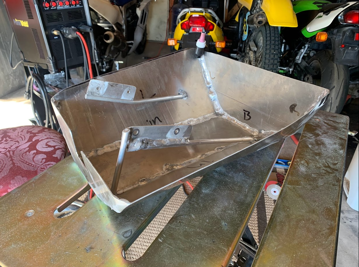 Home made aluminum belly pan and an AC/DC TIG welding machine in the background